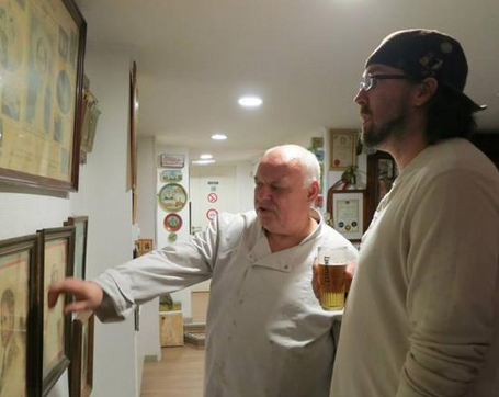 Chef Alain showing Kyle around his beer memorabilia when we were there for our Beer Geeks in Belgium trip in 2015.